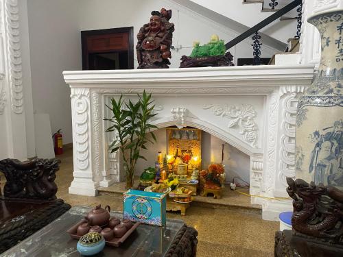 a living room with a fireplace in a house at 305HA Gest house in Ninh Binh
