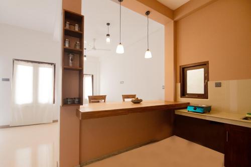 a kitchen with a desk and a mirror at Dimuthu Home in Ambalangoda