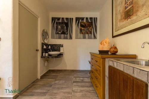 a bathroom with a sink and a counter top at Tsaakik Jungle Hotel & Spa in Canc&uacute;n