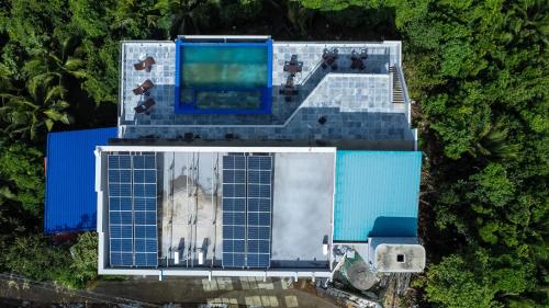 an overhead view of a building with a swimming pool at Horizon Hotel Romblon in Romblon
