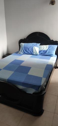 Postel nebo postele na pokoji v ubytování APARTASOL EN SANTA FE DE ANTIOQUIA