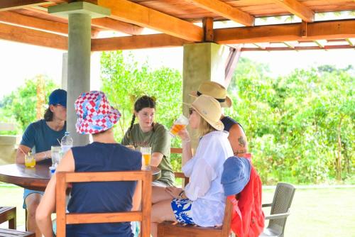 a group of people sitting at a table at Ceylon Nature Paradise in Uragasmanhandiya