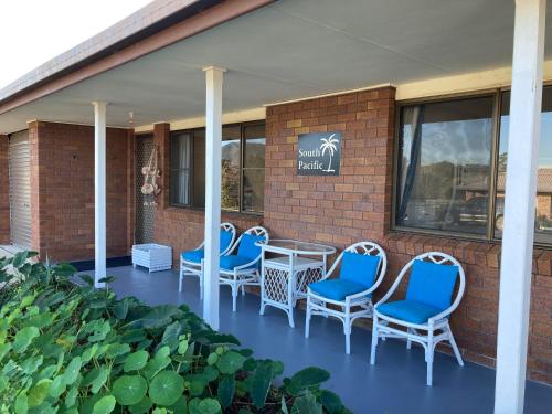 a group of chairs and a table on a patio at South Pacific in Scotts Head