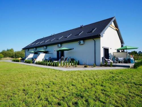 Spacious holiday homes with terraces, Mielenko