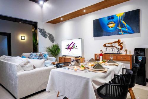 a living room with a table and a couch at Focus on 4 in Seminyak