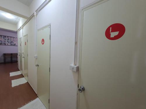 a room with a door with a letter l on it at Allred Hostel Chiangmai in Chiang Mai
