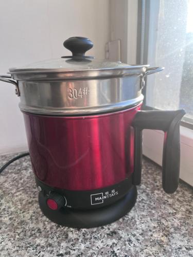 a slow cooker sitting on top of a counter at VERY central location near State department store in Ulaanbaatar