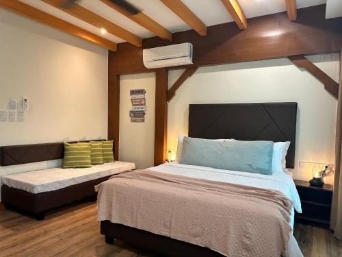 Кровать или кровати в номере Lee Boutique Hotel Baguio