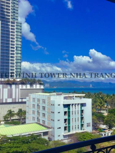 a building with a sign that reads hotel tower nita transfer at Tuệ Tĩnh Tower in Nha Trang