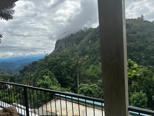 a balcony with a view of a mountain at Country Homes in Ella