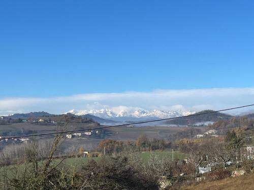 a view of snow covered mountains in the distance at Appartamento in Montiglio