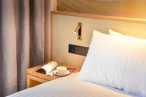 Кровать или кровати в номере Aurea Hotel Perth Kings Park