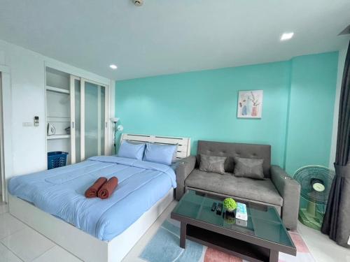 Ένα ή περισσότερα κρεβάτια σε δωμάτιο στο Pixel Condo - Panwa Beach