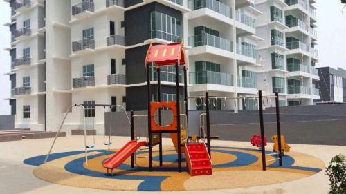 a playground in front of a apartment building at Sekinchan 2008 Homestay 悦客 法式奶油风民宿 in Sekincan