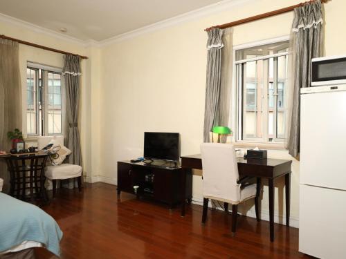 TV a/nebo společenská místnost v ubytování Ladoll Service Apartments