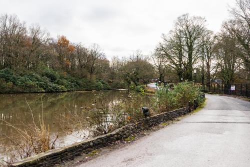 a road next to a river with a body of water at Park hall Hotel & Spa Lancashire, a member of Radisson Individuals in Eccleston