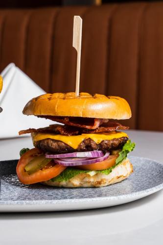 a sandwich on a plate with a toothpick in it at Park hall Hotel & Spa Lancashire, a member of Radisson Individuals in Eccleston