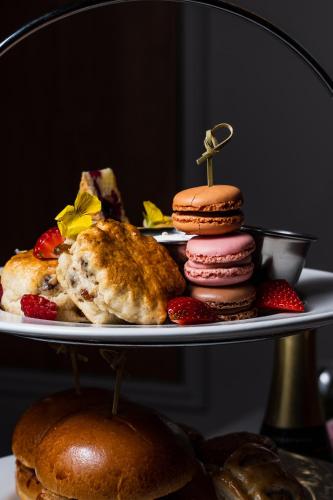 a plate of food with pastries and bread on it at Park hall Hotel & Spa Lancashire, a member of Radisson Individuals in Eccleston