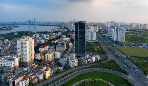 an aerial view of a city with buildings and a river at Luxury Pentstudio Westlake - Tay Ho, Ha Noi in Hanoi