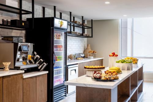 a kitchen with a counter with a plate of food on it at Delta Hotels by Marriott Wichita Falls Convention Center in Wichita Falls