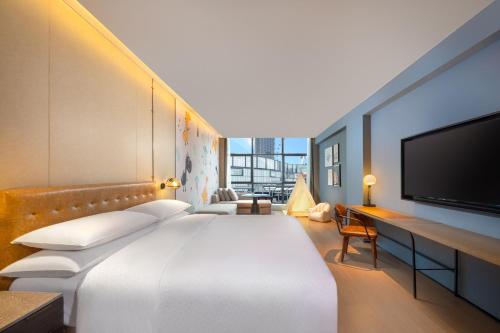Postel nebo postele na pokoji v ubytování Four Points by Sheraton Chongqing, Yongchuan