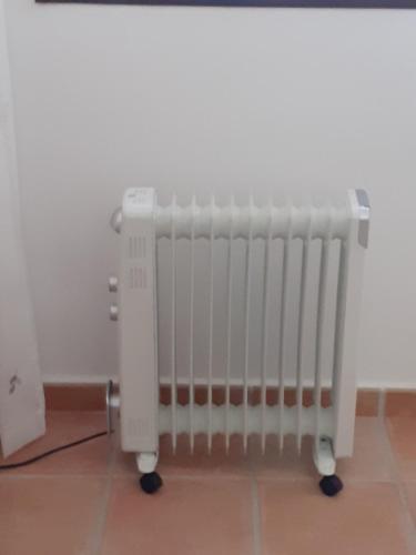 a radiator sitting in a room next to a wall at Casa Luna in Lentegí