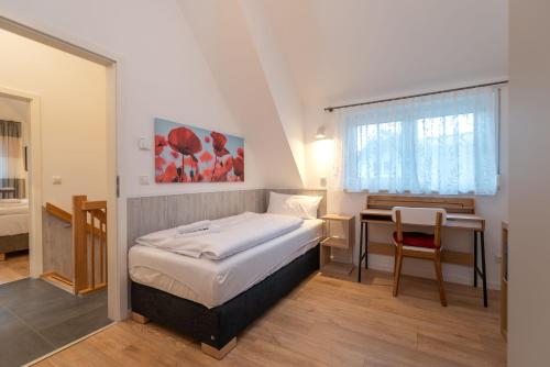 Postel nebo postele na pokoji v ubytování Ferienhaus "Am Kiefernwäldchen"