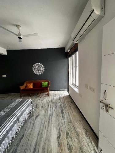 a bedroom with a bed and a window at Metro Connected Homestay with Parkview in Greater Noida