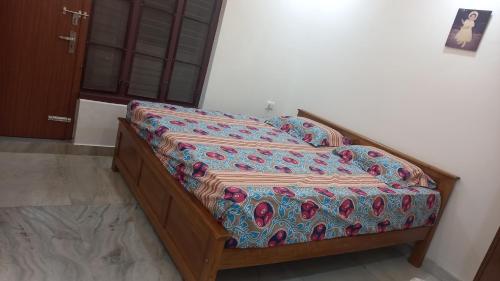 a bed in a room with at Niks home stay -C in Trichūr
