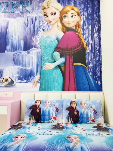a disney princess bedding set with a picture ofrozen at UG Homestay BP - Netflix & 4 Air-Con Rooms in Batu Pahat
