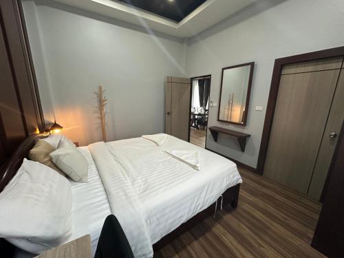 a bedroom with a large white bed and a mirror at Luxury Private Pool Villa-Ao Nang Krabi 2 in Ao Nam Mao