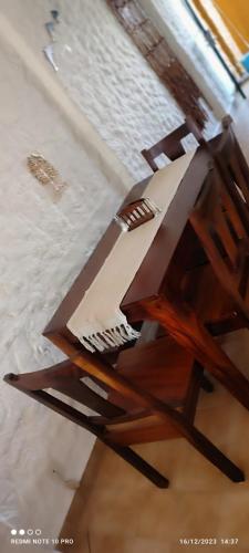 a wooden chair sitting on top of a table at Sol y Mar. Delfines in Ixtapa