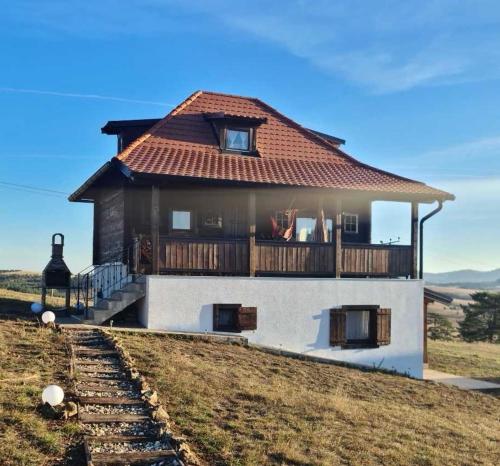 a house sitting on top of a hill at Zlatiborski katuni in Zlatibor