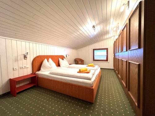 a bedroom with a large bed in a room at Apartments Pichler in Neukirchen am Großvenediger
