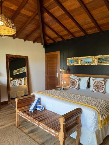 Ένα ή περισσότερα κρεβάτια σε δωμάτιο στο Pousada Villa Canaã