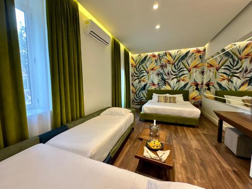 Ένα ή περισσότερα κρεβάτια σε δωμάτιο στο Le Palazzine Hotel