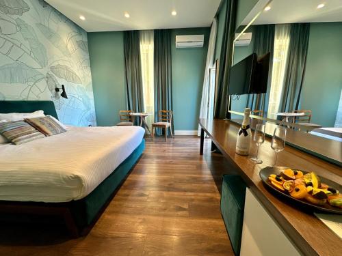 Ένα ή περισσότερα κρεβάτια σε δωμάτιο στο Le Palazzine Hotel