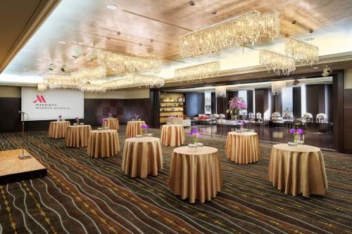 a row of tables in a room with chandeliers at Nagoya Marriott Associa Hotel in Nagoya