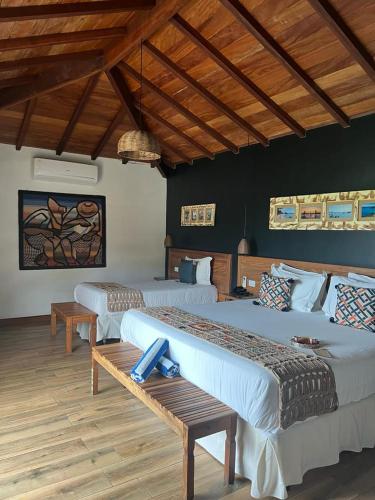 Ένα ή περισσότερα κρεβάτια σε δωμάτιο στο Pousada Villa Canaã