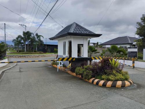 a roadblock with a small building on a street at Vin's Place Rentals in Tagum