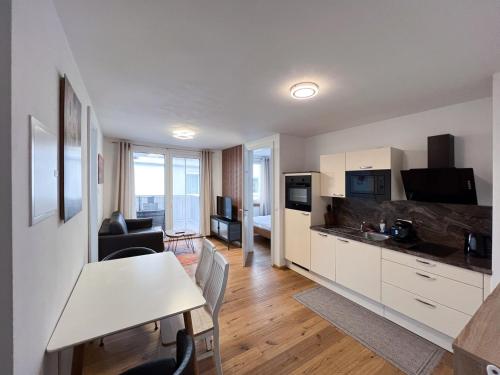 A kitchen or kitchenette at Modern apartment w/ cozy balcony near city center