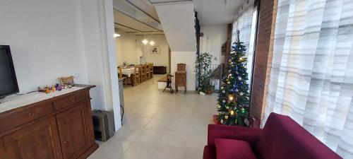 a living room with a christmas tree in the hallway at CASA LAVANDA in Rivoli