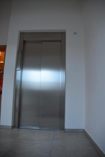 a large metal elevator in a building at Ferienwohnung beim Hainz in Dietramszell