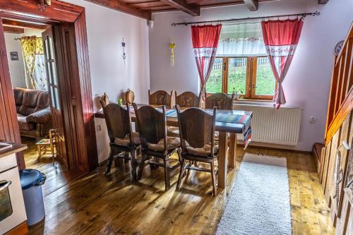 a dining room with a table and chairs at Chata Mojer in Ždiar