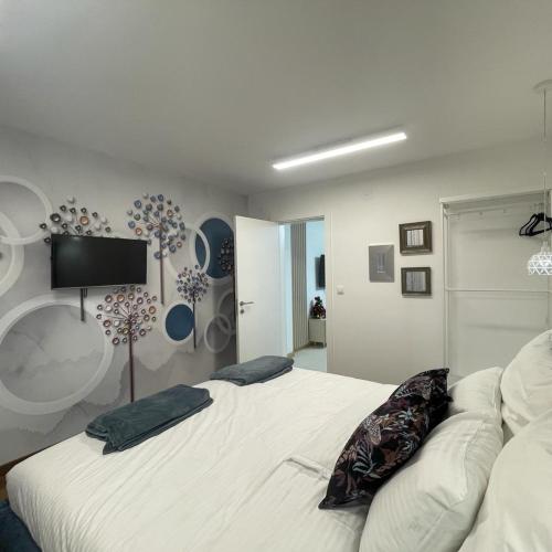 a bedroom with a bed with two pillows on it at NBG113 apartment in Belgrade
