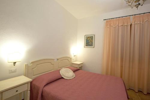 Postel nebo postele na pokoji v ubytování Podere Figlinelle