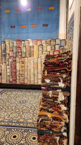 a store with a bunch of racks of wine bottles at Palais Chahd Luxury in Fès
