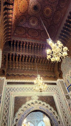 a chandelier hanging from a ceiling in a building at Palais Chahd Luxury in Fès