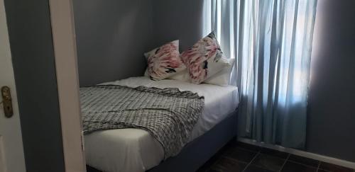 Ένα ή περισσότερα κρεβάτια σε δωμάτιο στο BnB Panorama