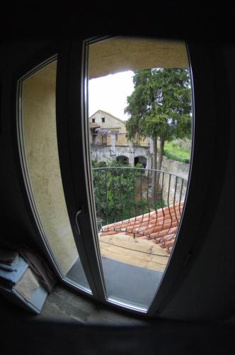 a window in a car looking at a balcony at Agriturismo La Contessa in Finale Ligure
